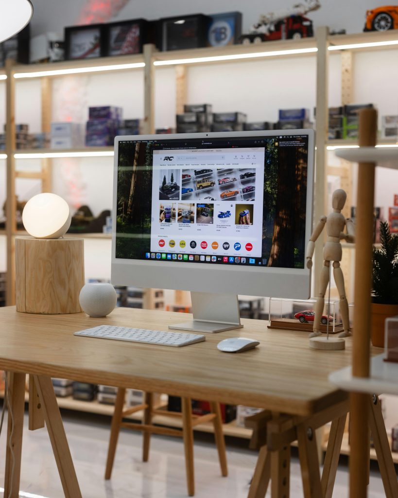 A sleek minimalist workspace in a toy store with stylish decor and digital display.